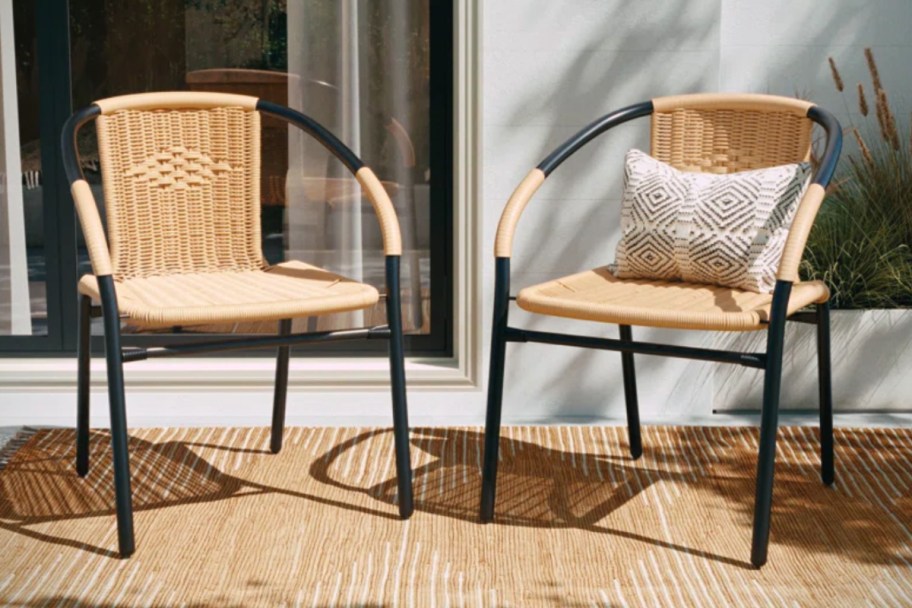 two wicker and black chairs