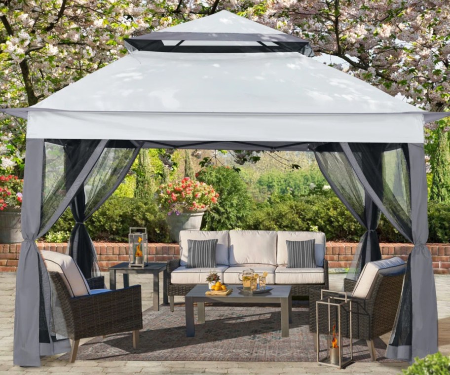 grey patio gazebo outside over furntiture