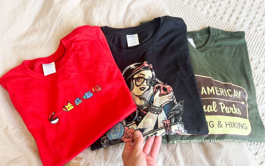 three folded woot tees in a fanned out display