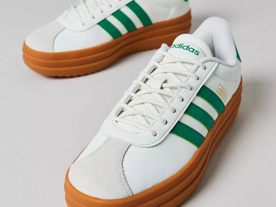 A pair of green and white sneakers