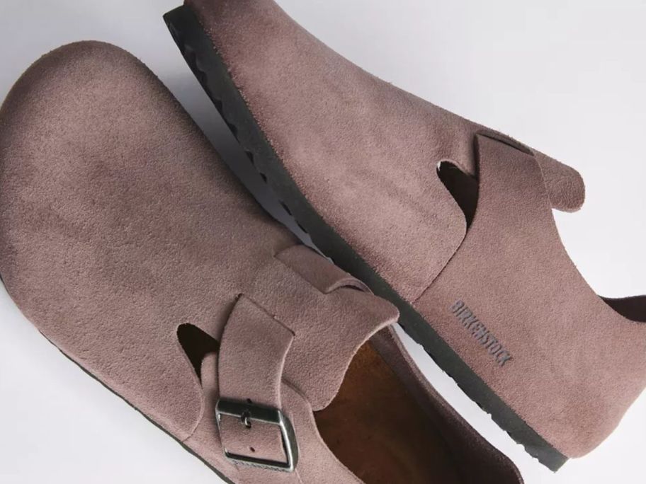 A pair of brown clogs