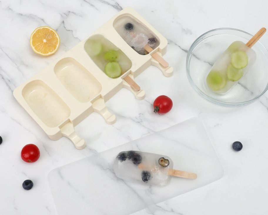 a 4 slot cakesicle mold on a kitchen counter