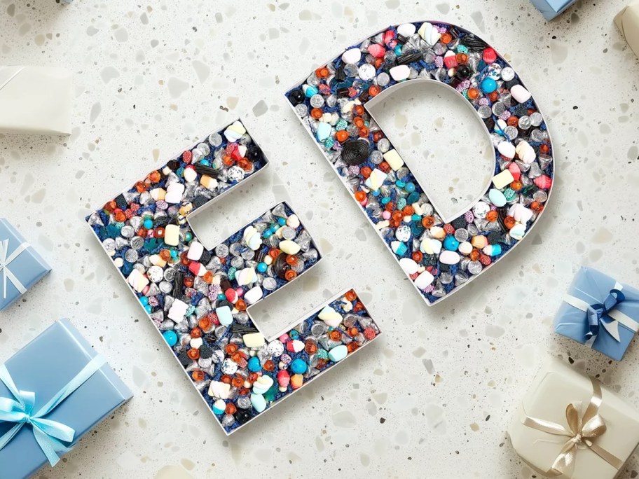 letters that spell ED filled with colorful rocks