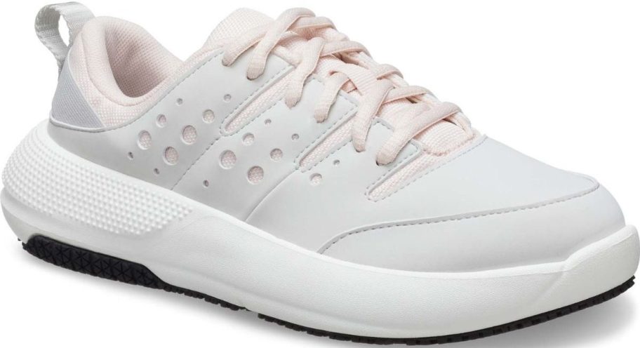a womans white senaker