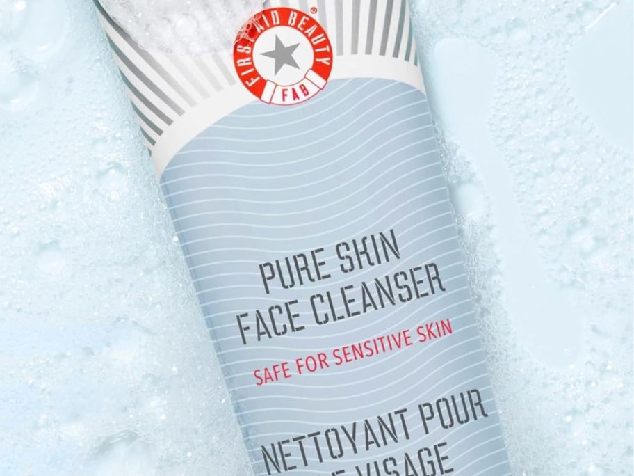 first aid beauty skin cleanser 8oz in a water bath