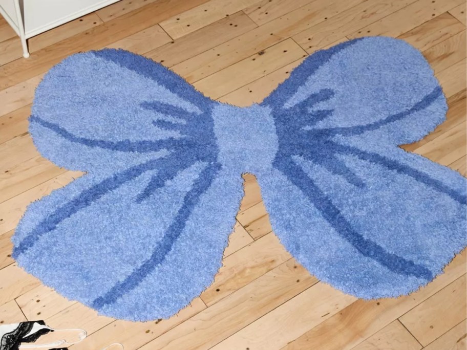 a blue bow shaped accent rug