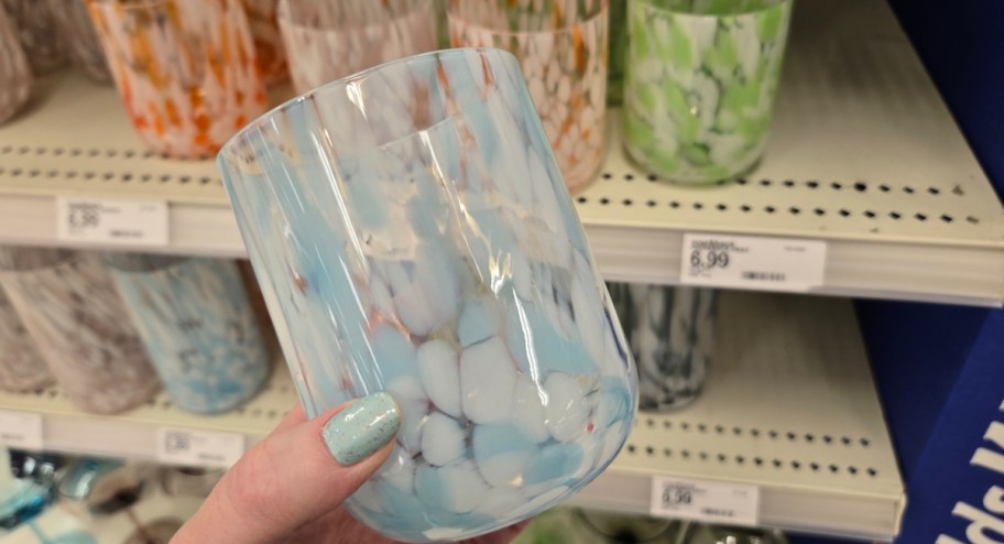 Hand holding new glassware