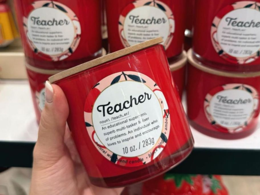 Hand holding a Kirkland's Teacher Gift Candle