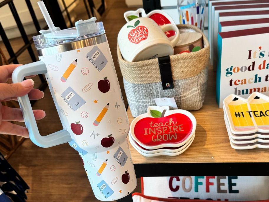 Hand holding a Kirkland's Teacher Otto 40oz Insulated Tumbler