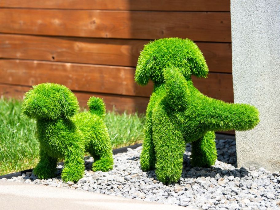 2 artificial dog topiaries