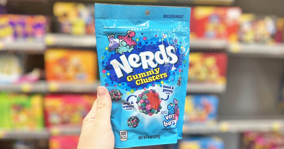 hand holding a blue bag of Nerds Gummy Clusters in store