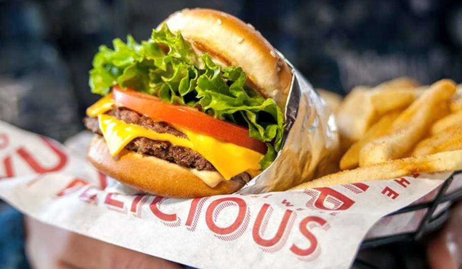 Red Robin burger with double patties and french fries in basket