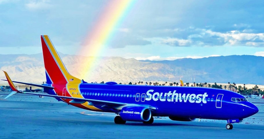 Southwest Airlines plane with rainbow in sky