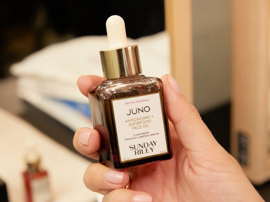 Sunday Riley Juno facial oil in hand