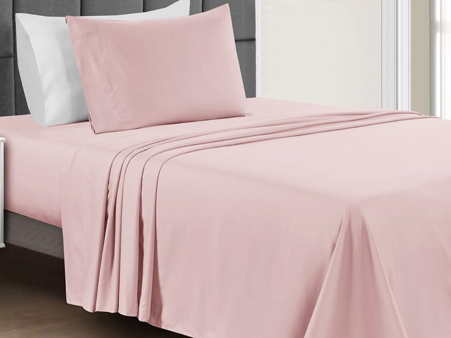 pink sheet set on bed with matching pillow case