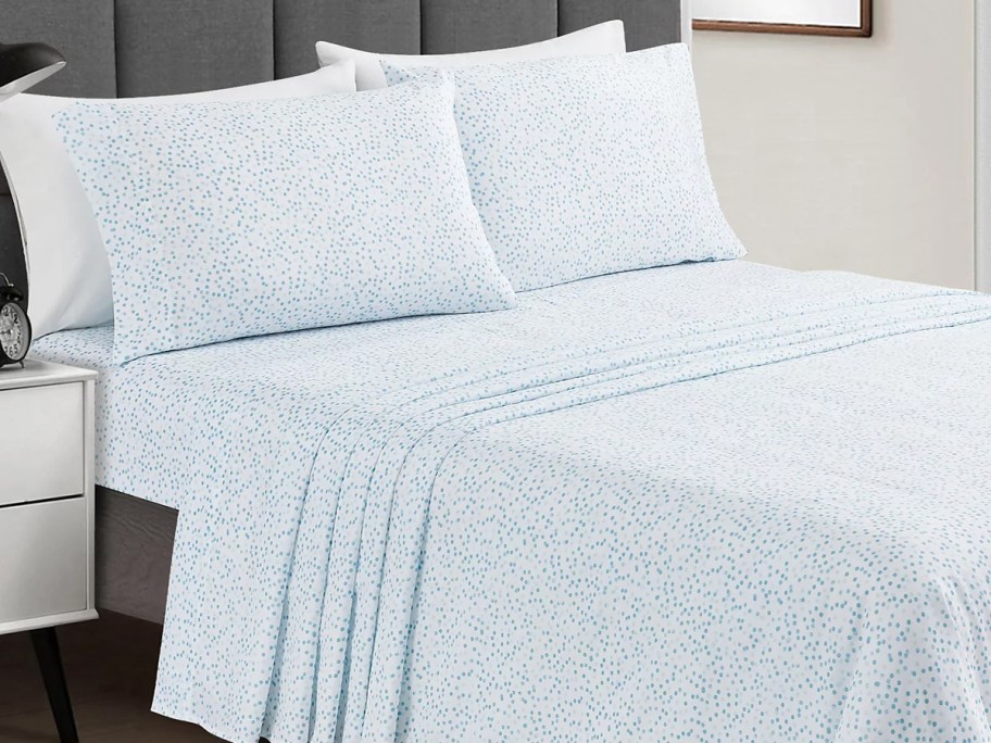 light blue sheet set on bed with matching pillow cases
