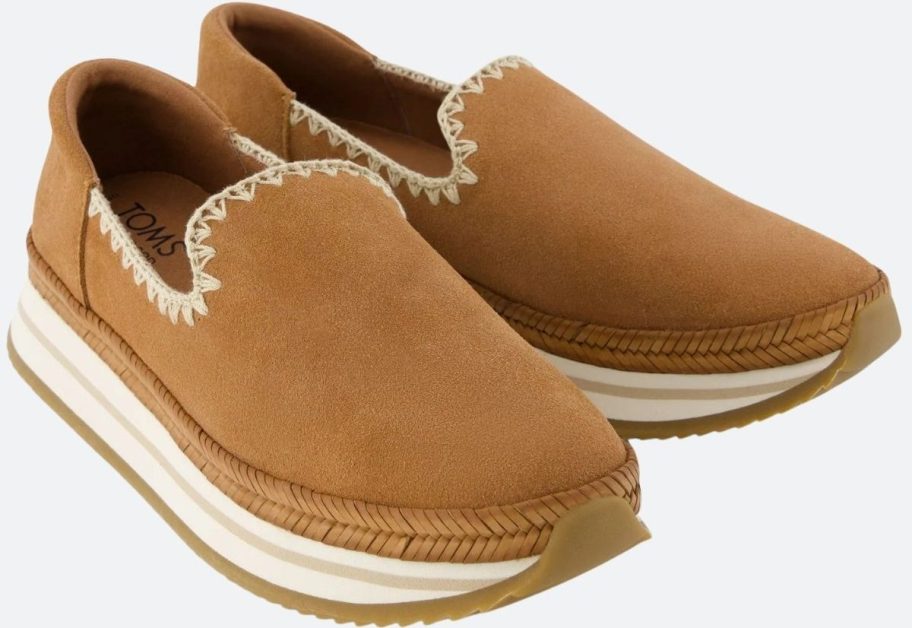 a pair of tan suede espadrille sneakers