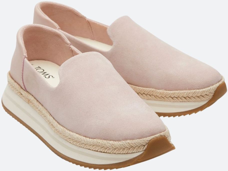 a pair of pale pink suede espadrille sneakers