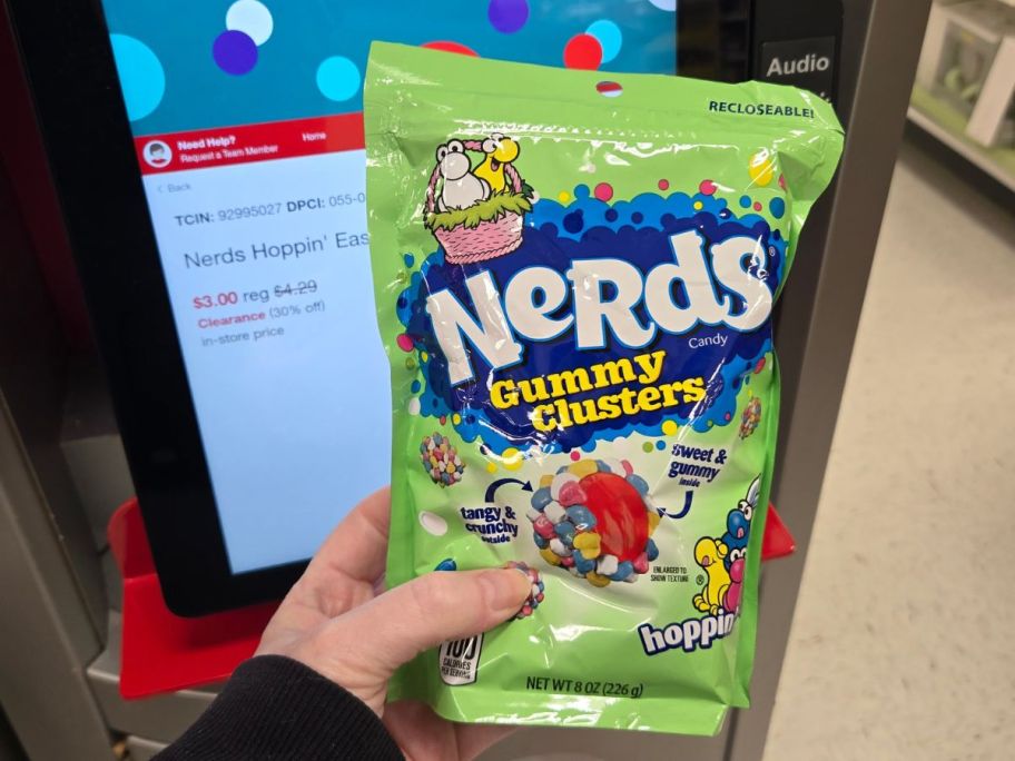 Hand holding a bag of Spring Nerds Gummy Clusters