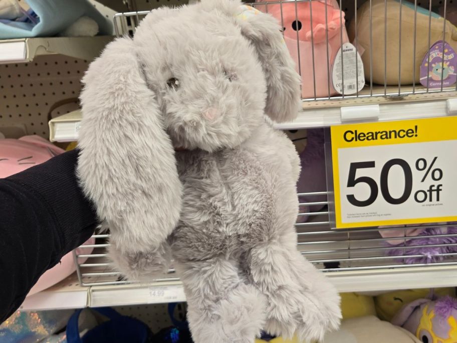 Hand holding a gray Gigglescape plush easter bunny