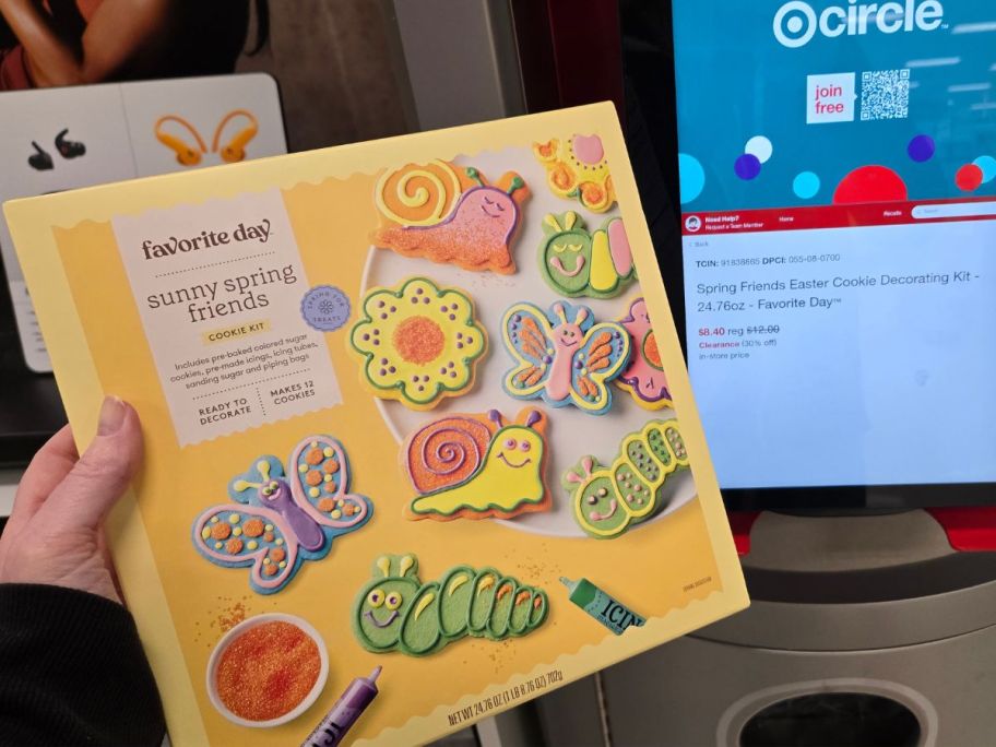 hand holding a Favorite Day spring easter cookie making kit in front of a price checker at Target