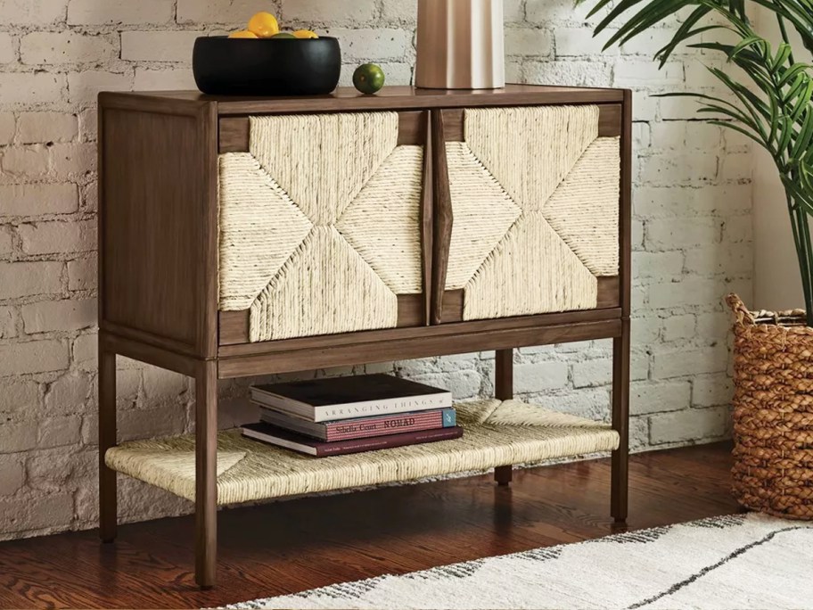brown storage cabinet with woven doors