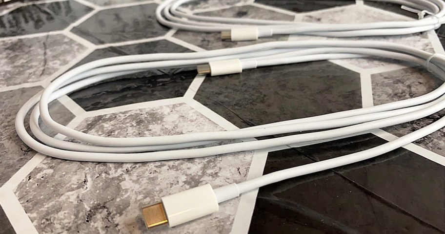 white usb-c charging cables on a tile floor