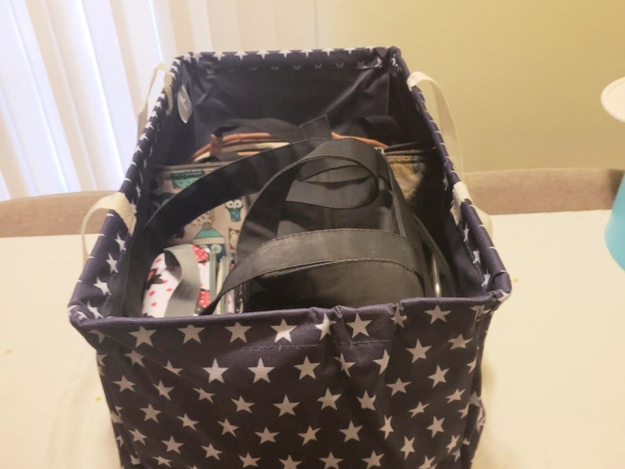 large canvas tote with star print full of accessories