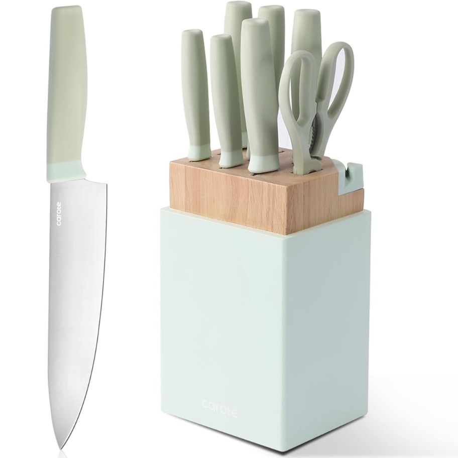 a green and wood knife block set and knife set, with a large chef knife to the side