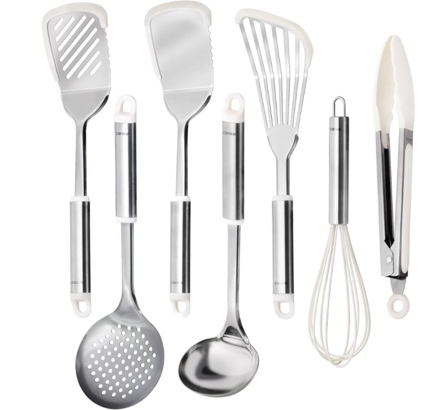 a nine piece set of stainless steel kitchen utensils with silicone heads