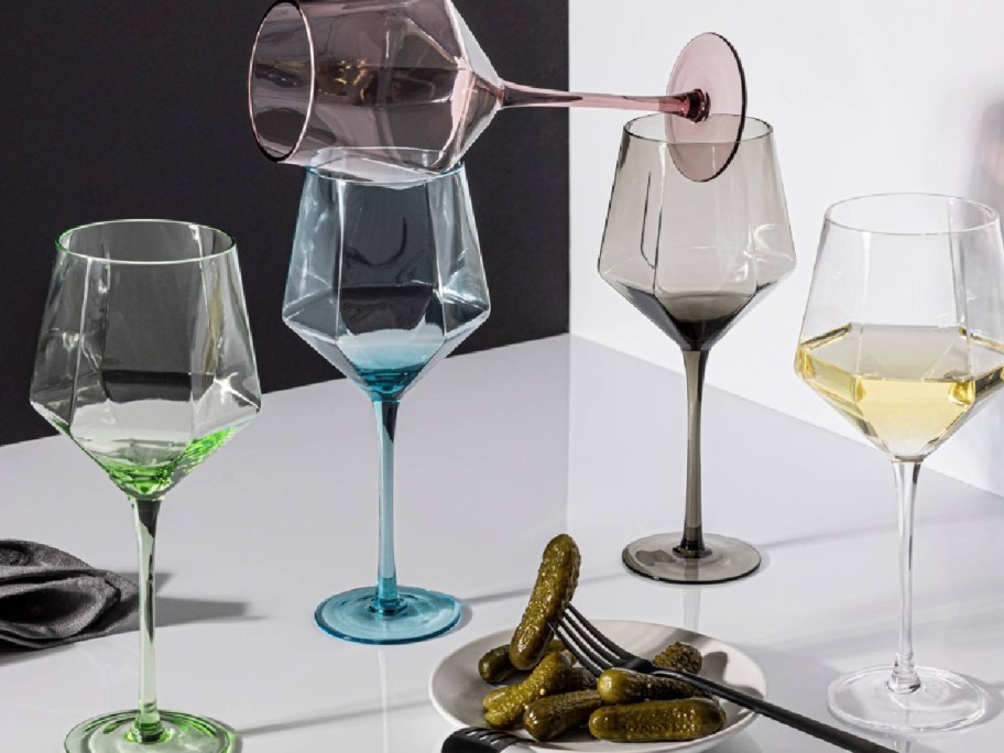 display of over&back 17.6 fl oz Facet Stemmed Wine Glass mounted on top of the table