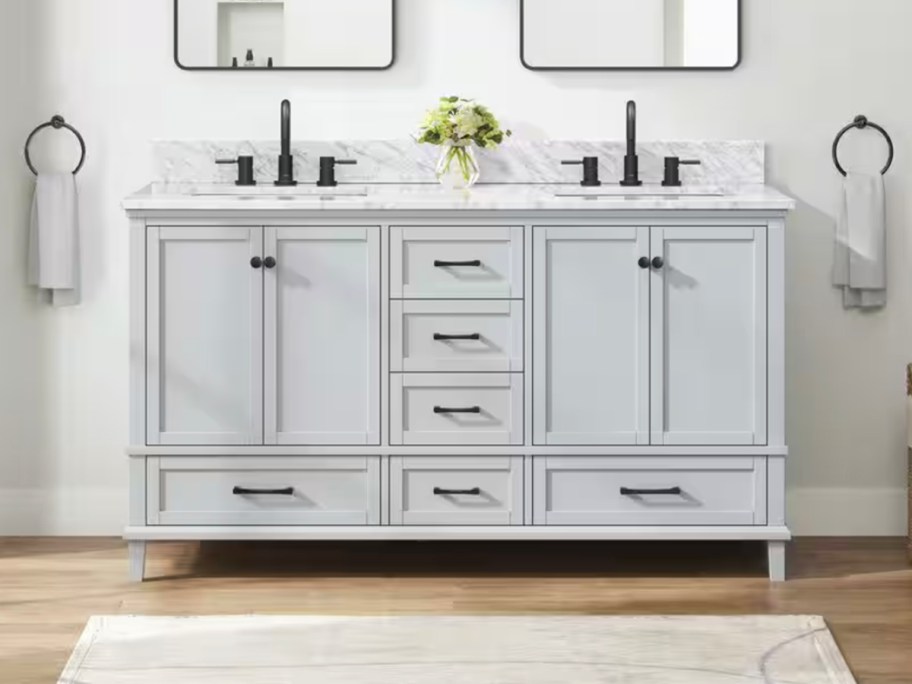 gray double bath vanity with flowers on top 