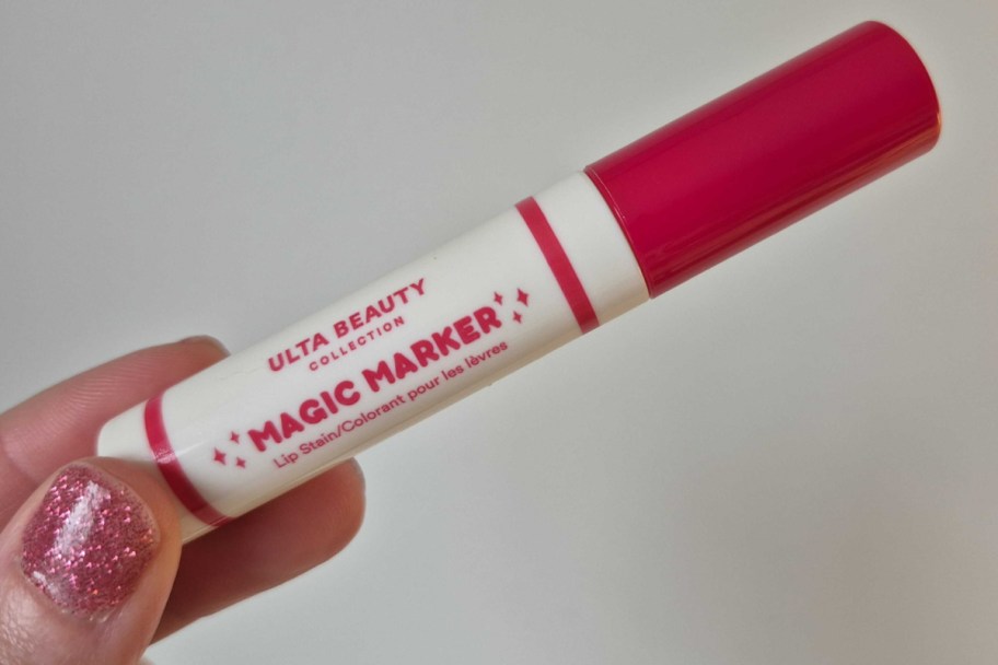 fingers holding magic marker lip stain