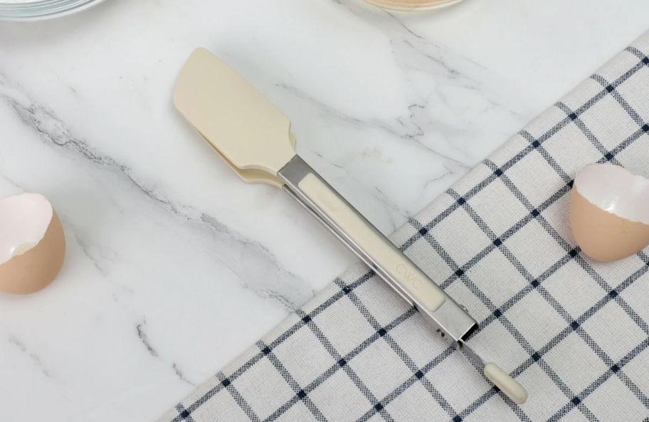 a pair of mini tongs on a kitchen countertop