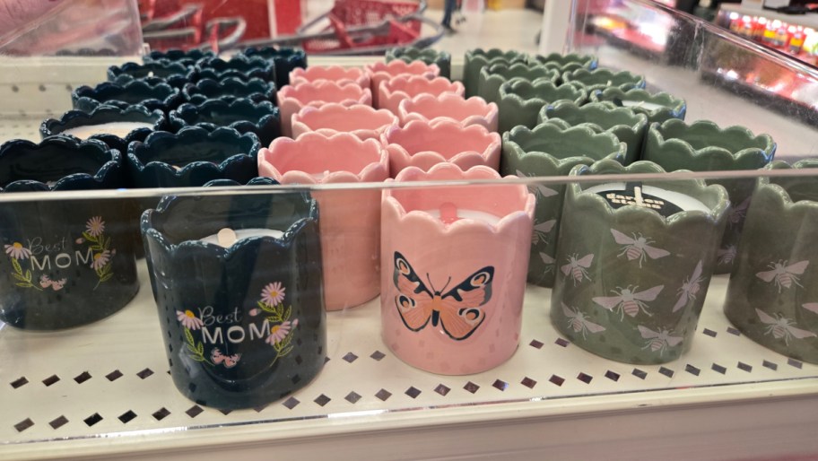 votive candles in mom and spring designs on a store shelf