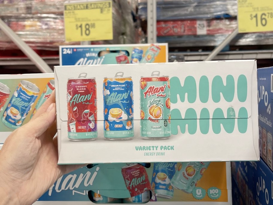 hand holding alani soda box