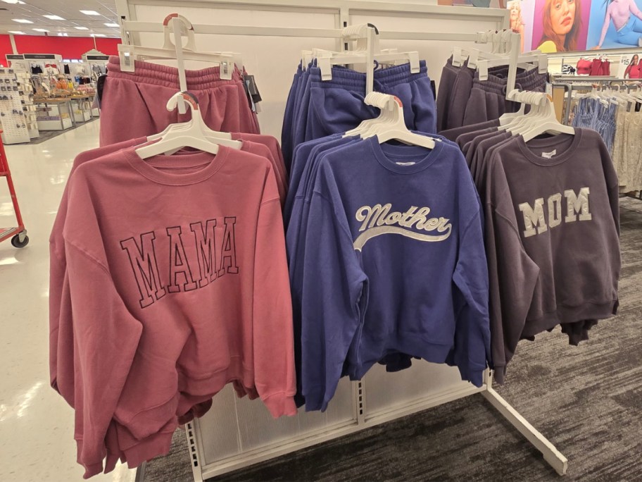 display of sweaters and sweatpants in different colors