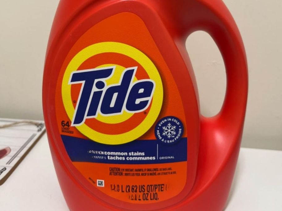 Tide Liquid Laundry Detergent 84oz bottle on washing machine
