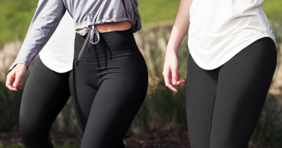 three women wearing black leggings
