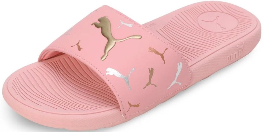 a pink womens slide sandal with metallic puma print