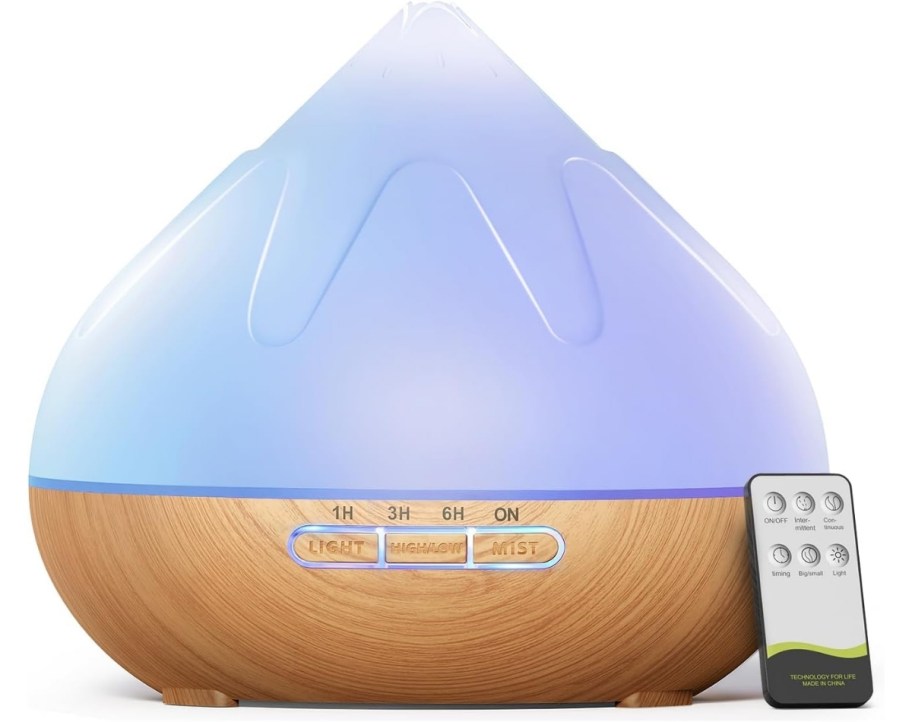 an aromatherapy diffuser with a blue led light and a remote