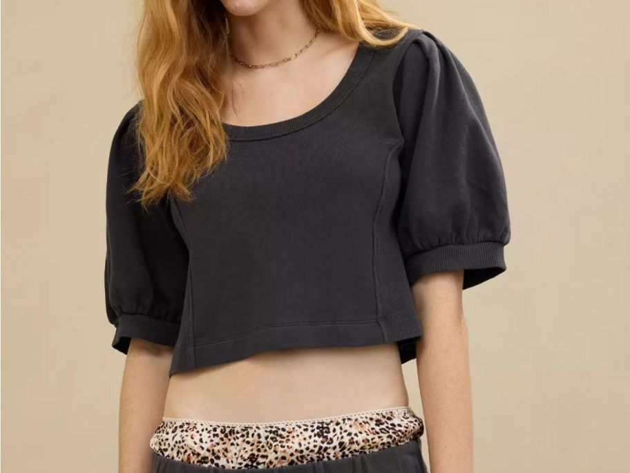 A woman wearing an Aerie sweatshirt