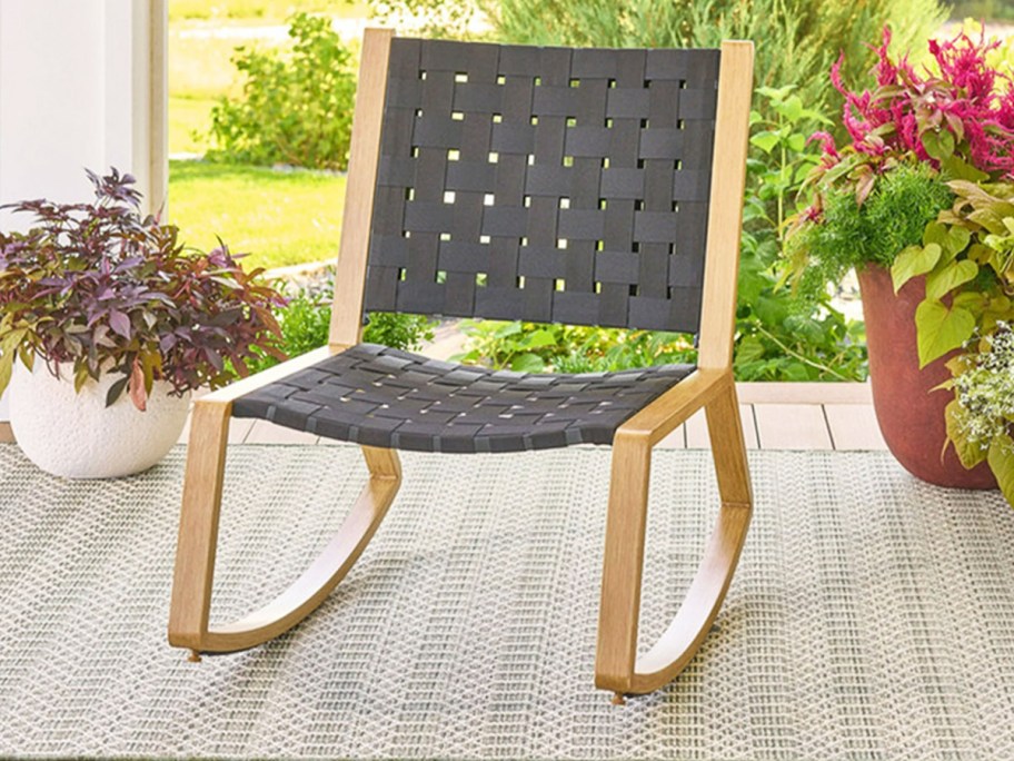 black woven rocking chair on patio