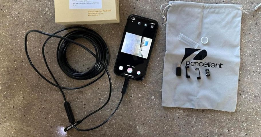 Pancellent Endoscope plugged into a smartphone with accessories