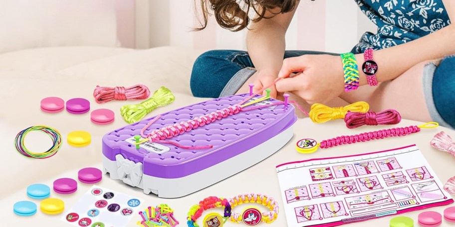 Girl Using a Bracelet Making Loom Kit