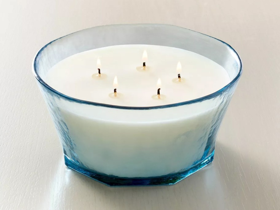 Hearth & Hand with Magnolia 32oz Textured Glass Sun and Citron Jar Candle sitting on a counter
