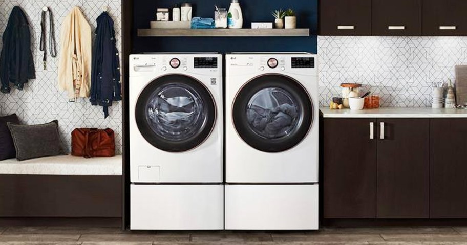 white and black washer dryer set in laundry room