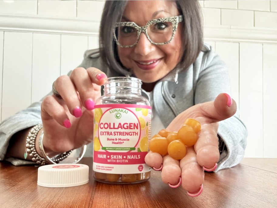 woman holding a handful of Lunakai Collagen Peptides Gummies