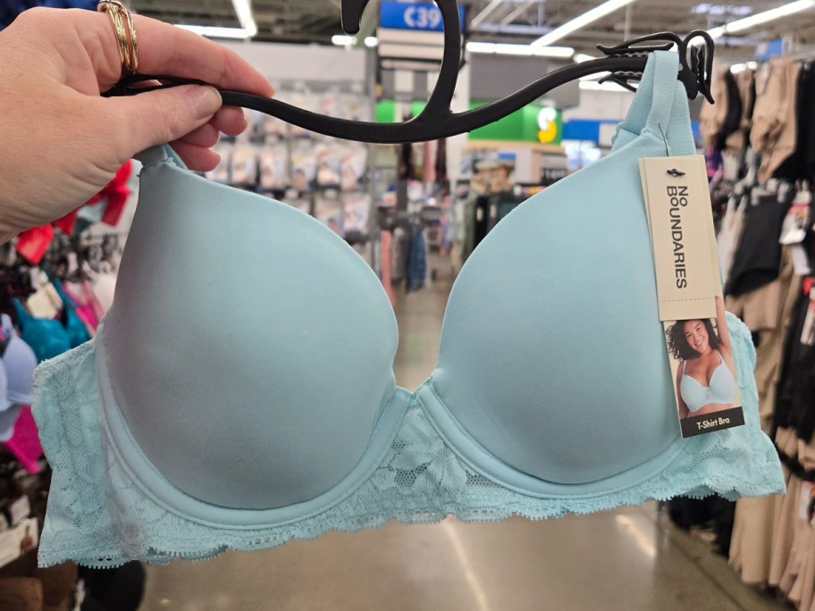 No Boundaries Demi Underwire T-Shirt Bra with Sugarcup in sky blue being held in a Walmart