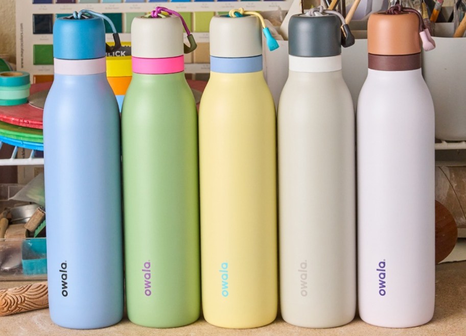 colorful Owala water bottles in a row